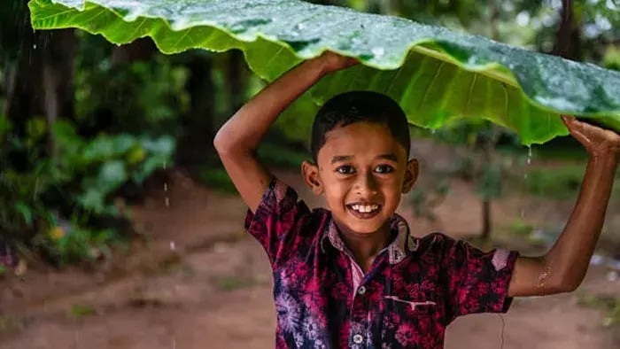 Indian kids holding leaf