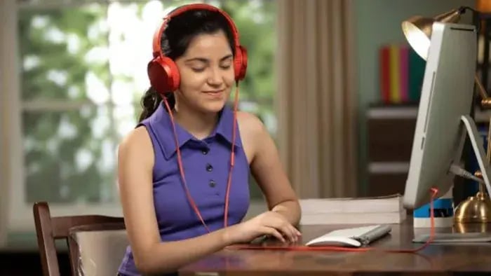 Indian kid listening to music