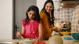 Indian kids cooking with parents