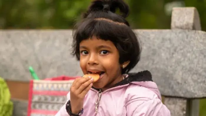 Indian kids eating food