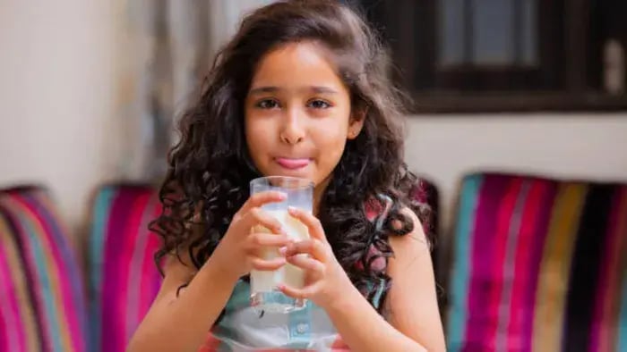 Indian Kid Drinking Juice