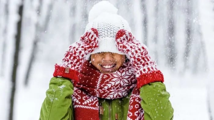 kid wearing cap and a muffler