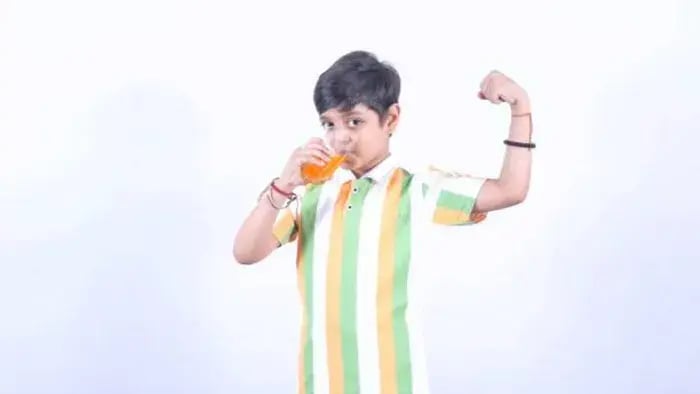 Indian kids drinking juice
