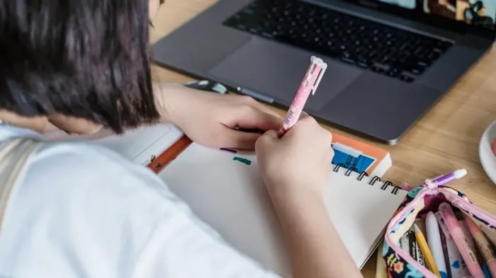 Girl Writing With Pencil
