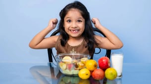 Indian Kids Eating Fruits