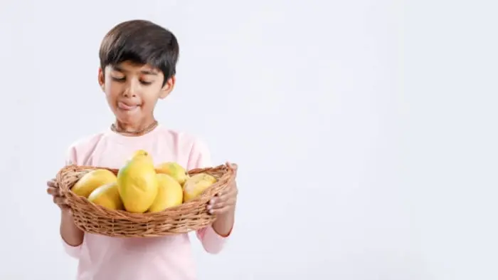Indian kids enjoying fruits