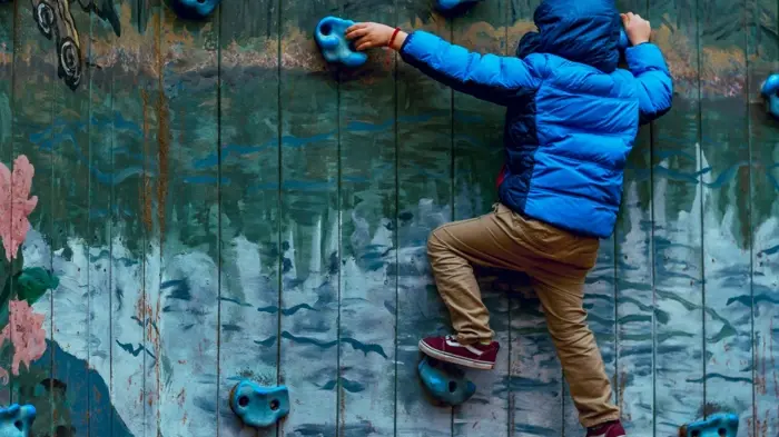 kid climbing on the wall